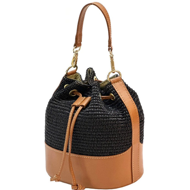 Black woven bucket bag with brown leather accents on a white background