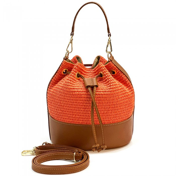 Orange woven bucket bag with brown leather accents on a white background