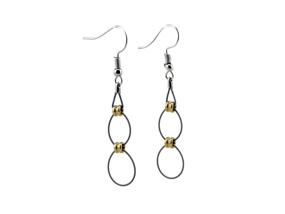 Unique earrings crafted from recycled guitar strings, combining music-inspired design with elegant jewelry craftsmanship.