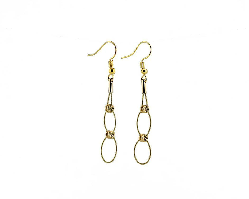 Unique earrings crafted from recycled guitar strings, combining music-inspired design with elegant jewelry craftsmanship.