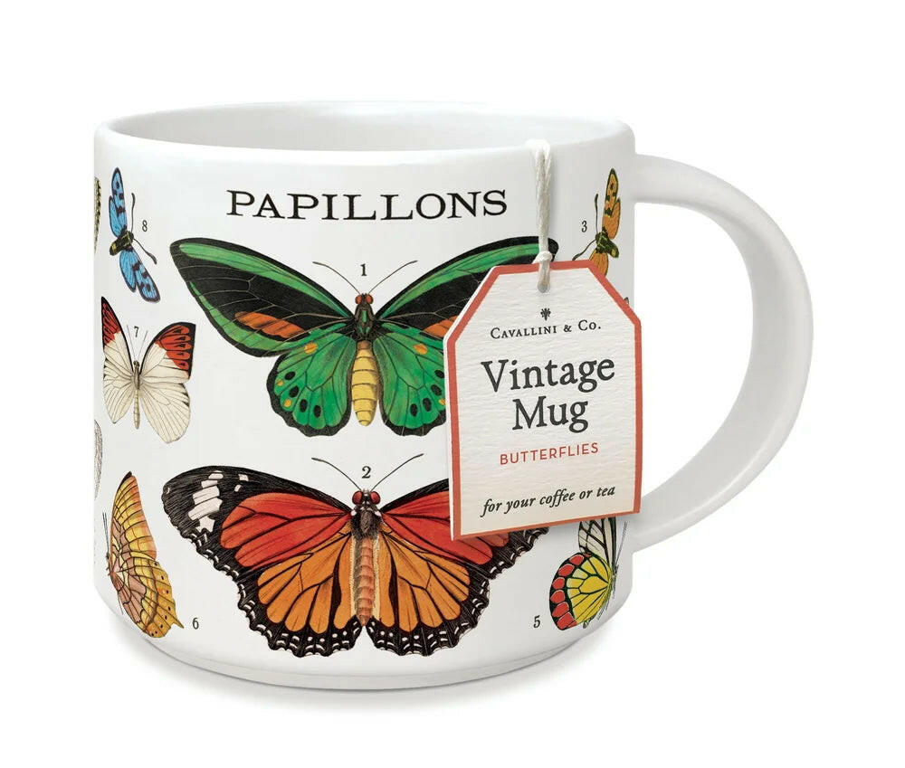 Mug with butterfly designs and a tag on a white background