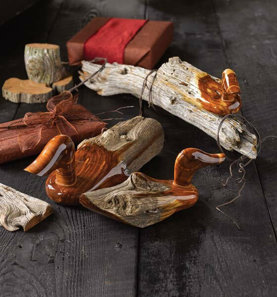 Wooden duck decoys on a dark wooden surface